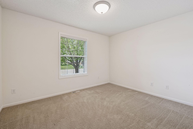 574 Marsh Dr, Delano, MN 55328 - unfurnished room featuring carpet, baseboards, and a textured ceiling