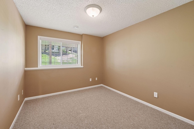 574 Marsh Dr, Delano, MN 55328 - carpeted spare room with a textured ceiling and baseboards