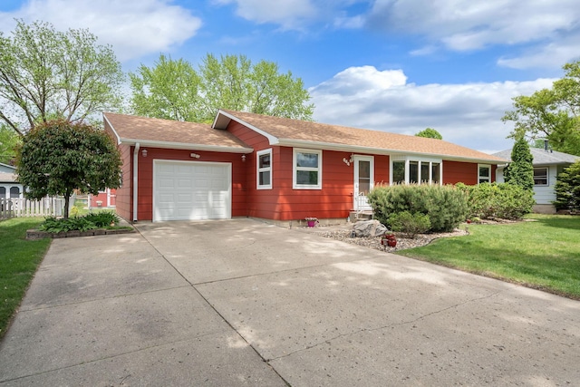 ranch-style house with an attached garage, concrete driveway, and roof with shingles