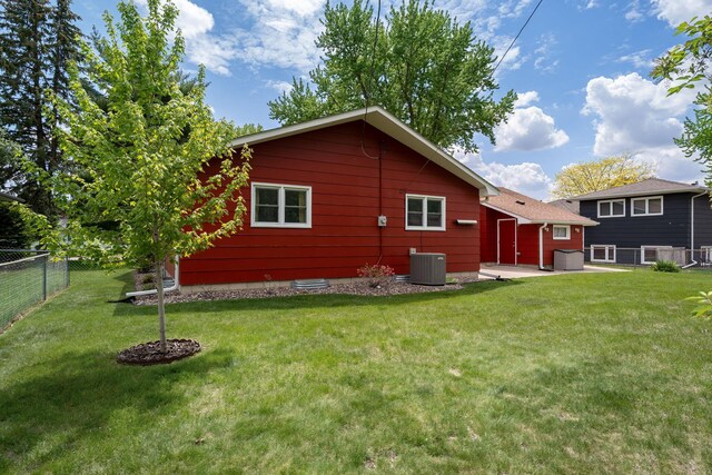 back of property featuring cooling unit and a patio area