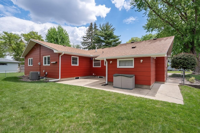 rear view of property featuring central air condition unit, a patio area, and roof with shingles