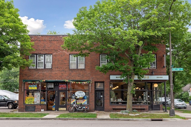 view of front of house featuring brick siding