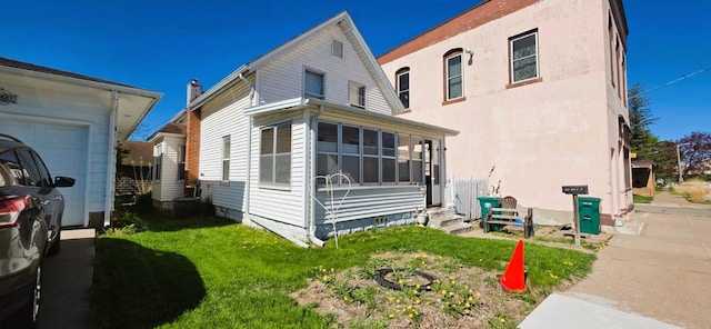 139 2nd St W, Wabasha, MN 55981 - rear view of property featuring a yard and entry steps