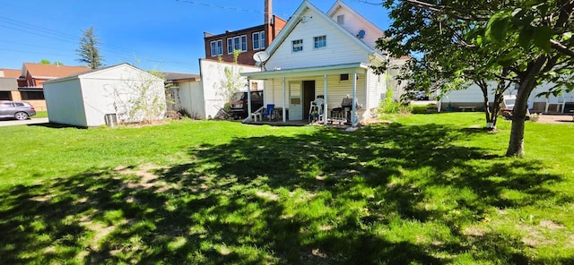 139 2nd St W, Wabasha, MN 55981 - back of property with a shed, a lawn, and an outdoor structure