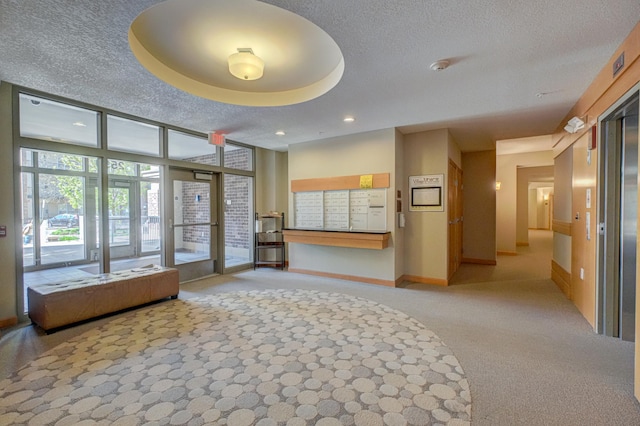 lobby with a textured ceiling and recessed lighting