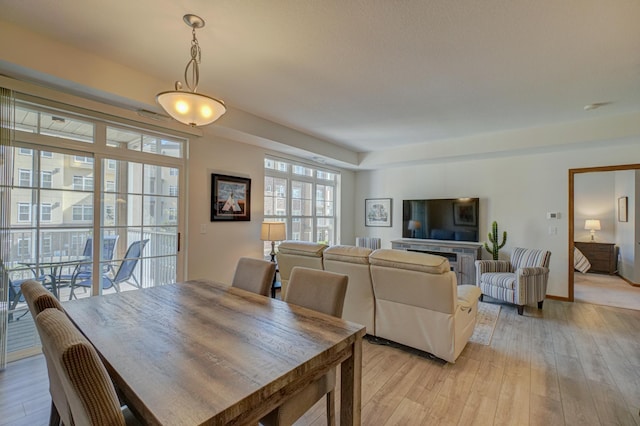 dining area with light wood-type flooring