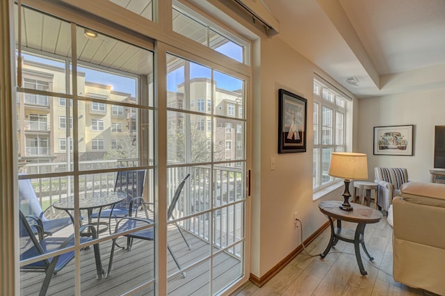 entryway featuring light wood-type flooring and baseboards
