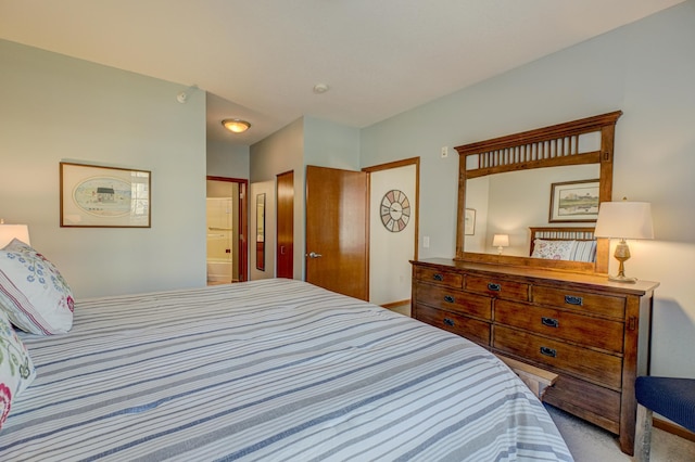 bedroom with carpet and ensuite bathroom