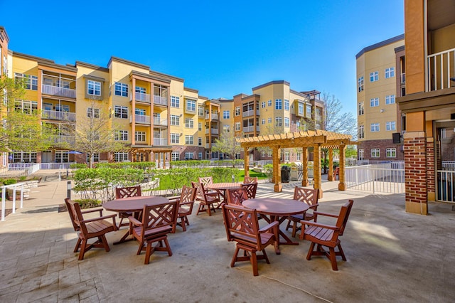 view of patio / terrace featuring a pergola and fence
