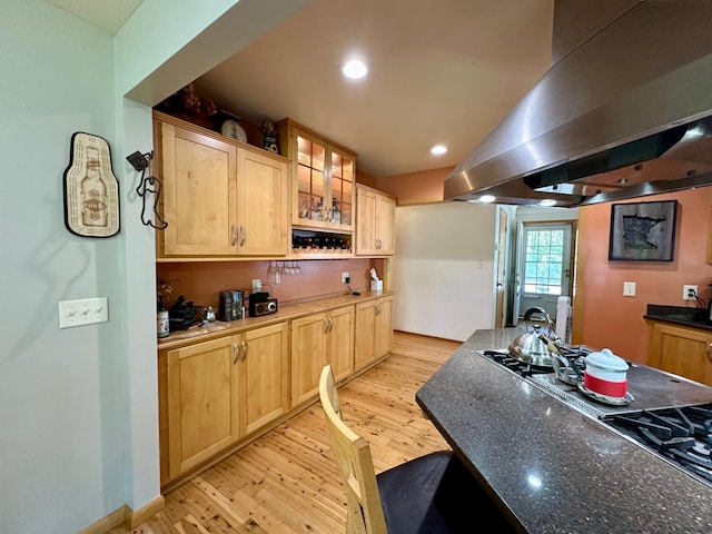 kitchen with island range hood, light brown cabinets, light wood finished floors, and recessed lighting