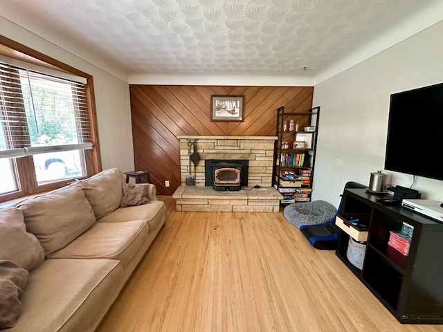 living area featuring wood finished floors and wood walls