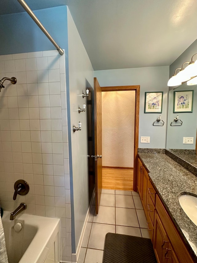 full bathroom featuring tile patterned floors, vanity, and bathtub / shower combination