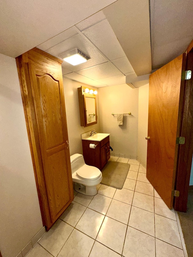 bathroom featuring toilet, tile patterned floors, and vanity