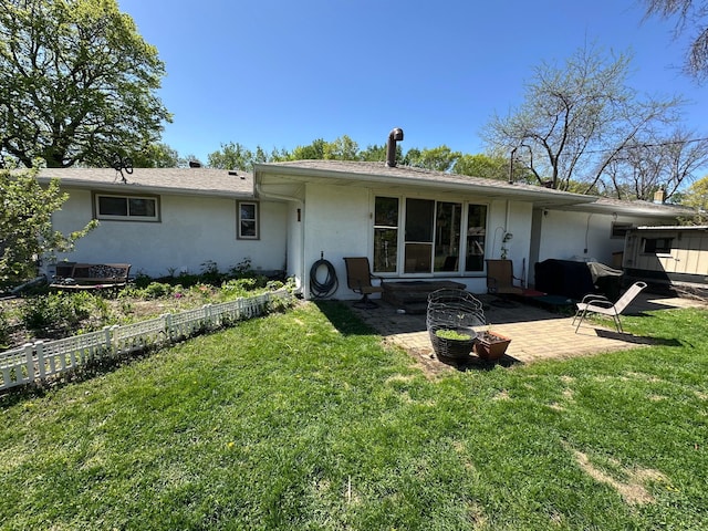 back of property featuring stucco siding and a patio area