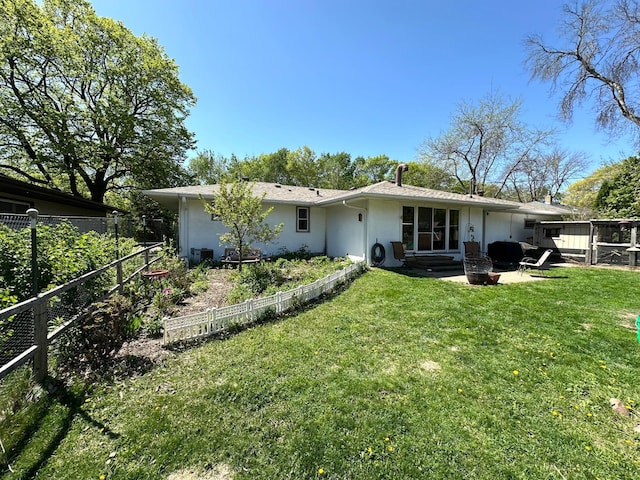 back of house featuring stucco siding and a patio area