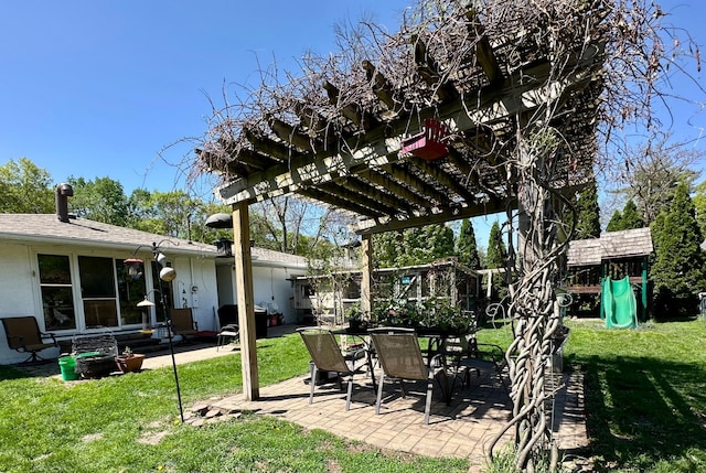 2127 S Ave E, North Saint Paul, MN 55109 - view of grassy yard with a pergola, a patio area, and a playground