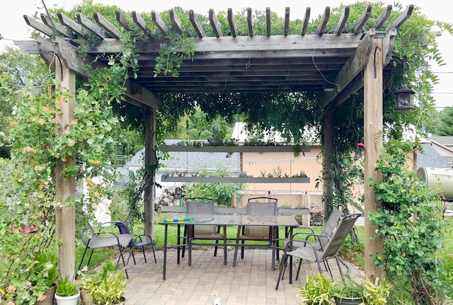 2127 S Ave E, North Saint Paul, MN 55109 - view of patio with outdoor dining space and a pergola