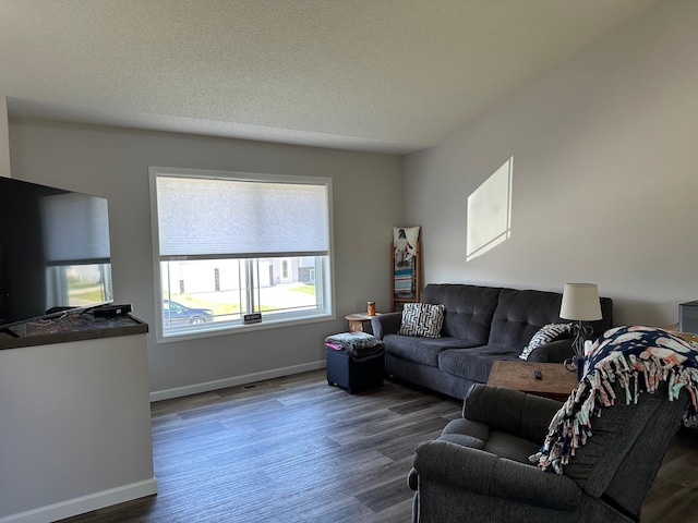 living room with wood finished floors and baseboards