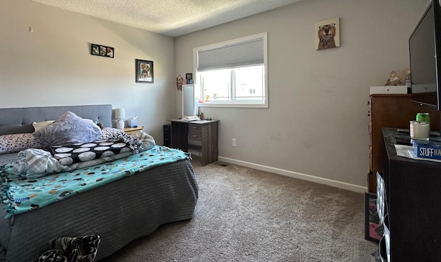 bedroom featuring carpet, a textured ceiling, and baseboards