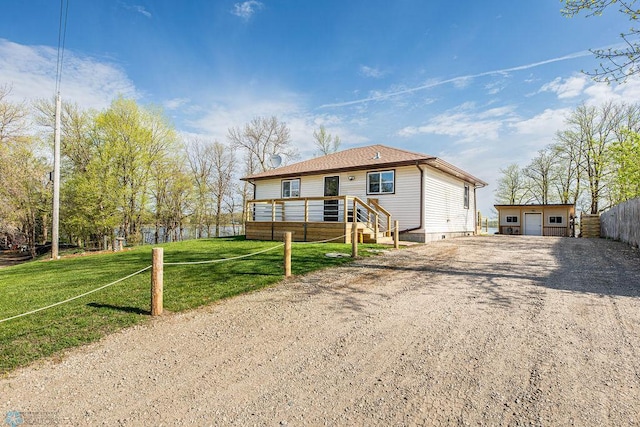 12606 Abbey Lake Ln, Lake View Twp, MN 56501 - view of front of house featuring driveway, an outbuilding, and a garage