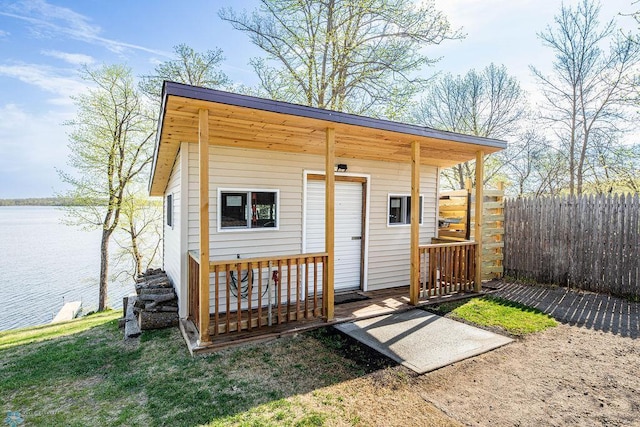 12606 Abbey Lake Ln, Lake View Twp, MN 56501 - view of outdoor structure with a water view, fence, and an outbuilding