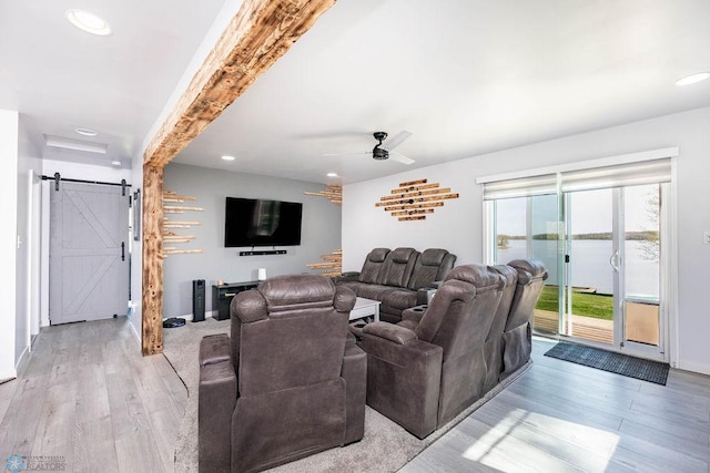 12606 Abbey Lake Ln, Lake View Twp, MN 56501 - living room featuring a barn door, light wood-style flooring, recessed lighting, stairs, and a ceiling fan