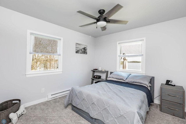 12606 Abbey Lake Ln, Lake View Twp, MN 56501 - carpeted bedroom featuring baseboard heating, baseboards, and ceiling fan