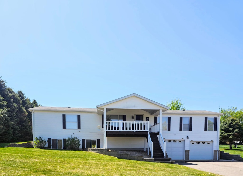 27 Lake Shetek Dr, Mason Twp, MN 56172 - view of front facade featuring a garage, a front yard, driveway, and stairs
