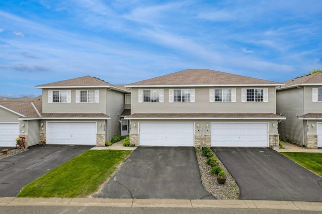 2141 Cleveland Ln S, Cambridge, MN 55008 - townhome / multi-family property with asphalt driveway and an attached garage