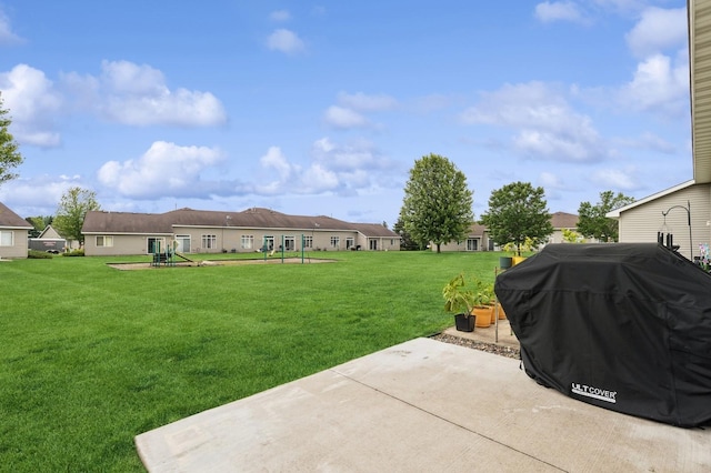 2141 Cleveland Ln S, Cambridge, MN 55008 - view of grassy yard with a playground and a patio area