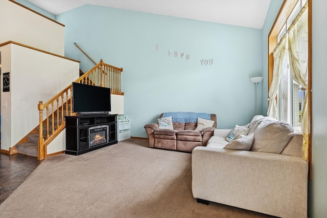 2141 Cleveland Ln S, Cambridge, MN 55008 - living area with stairs, lofted ceiling, and a glass covered fireplace