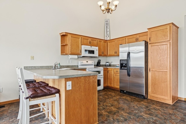 2141 Cleveland Ln S, Cambridge, MN 55008 - kitchen with white appliances, a peninsula, a chandelier, open shelves, and a breakfast bar area