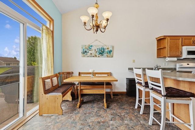 2141 Cleveland Ln S, Cambridge, MN 55008 - dining space featuring a chandelier and lofted ceiling