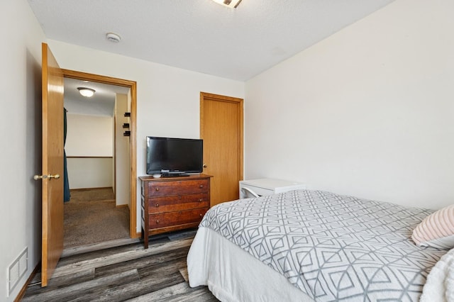 2141 Cleveland Ln S, Cambridge, MN 55008 - bedroom featuring dark wood-style flooring