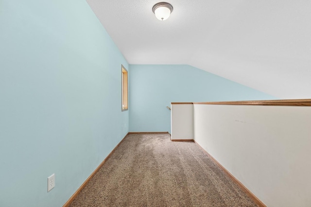2141 Cleveland Ln S, Cambridge, MN 55008 - additional living space featuring light colored carpet and vaulted ceiling