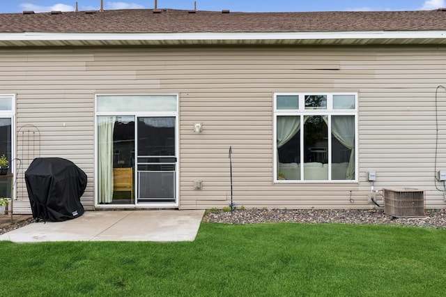 2141 Cleveland Ln S, Cambridge, MN 55008 - rear view of property featuring a patio area and a lawn
