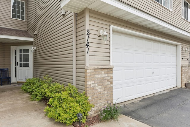 2141 Cleveland Ln S, Cambridge, MN 55008 - garage featuring asphalt driveway
