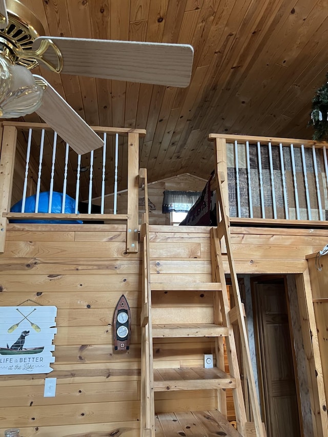 11749 Side Dr, Fine Lakes Twp, MN 55798 - stairway featuring wood ceiling, wooden walls, and lofted ceiling