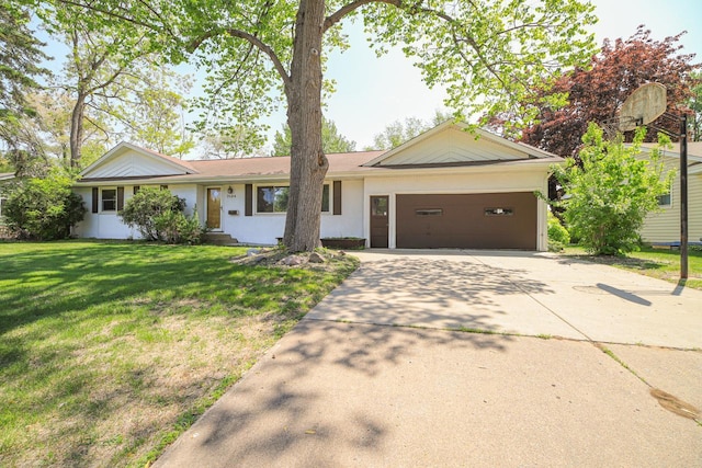 ranch-style home with a garage, concrete driveway, and a front lawn