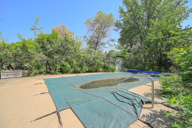 view of pool featuring a patio area and a covered pool