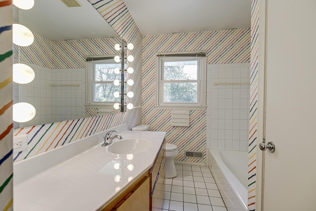 full bath with wallpapered walls, tile patterned flooring, plenty of natural light, toilet, and vanity