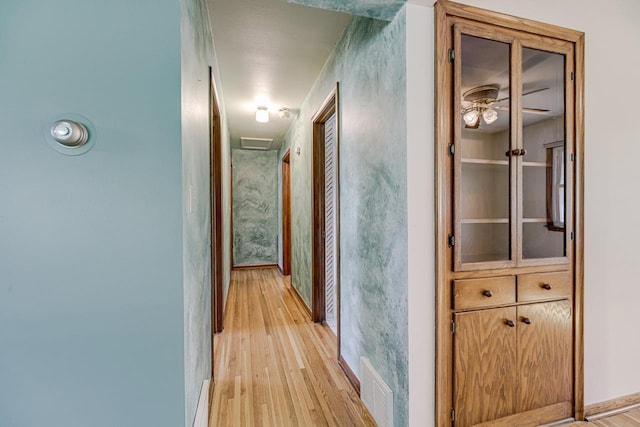 hallway featuring light wood-type flooring