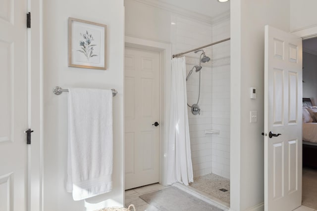 ensuite bathroom with a tile shower