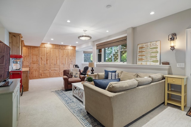 living room with recessed lighting and light carpet