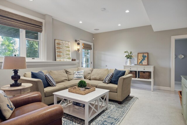 living room featuring recessed lighting and baseboards