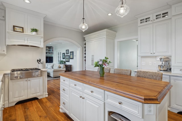 1924 Norway Pine Rd, East Gull Lake, MN 56401 - kitchen with stainless steel gas stovetop, arched walkways, wooden counters, white cabinets, and crown molding
