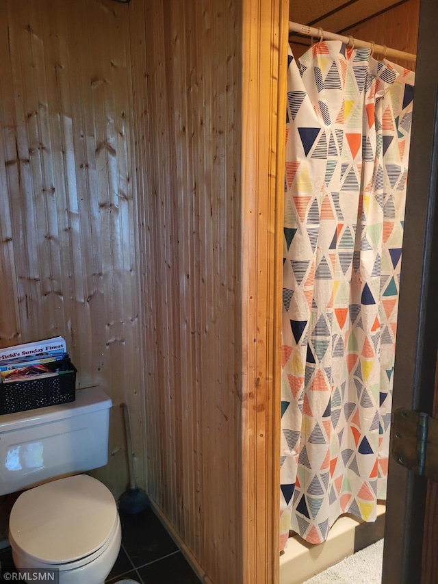 8743 Unit Ave, Stewart, MN 55385 - bathroom with a shower with curtain, wood walls, toilet, and tile patterned flooring
