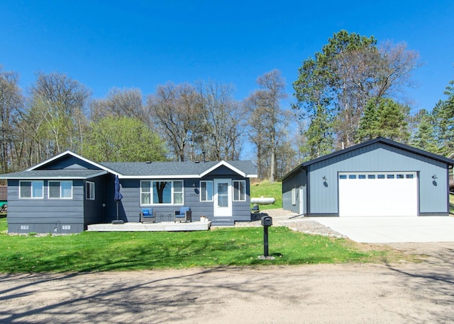 single story home with a garage, an outdoor structure, a front yard, and crawl space