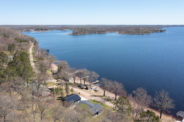 aerial view of property's location with a large body of water