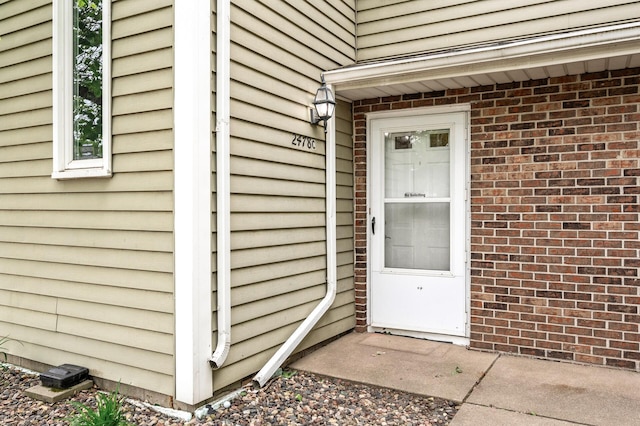 2478 Cobble Hill Alcove Unit C, Woodbury, MN 55125 - view of exterior entry with brick siding